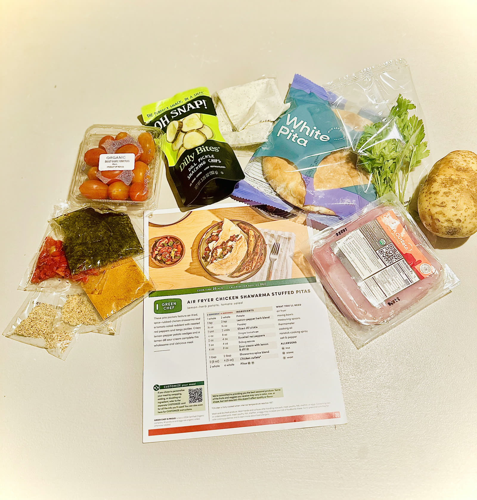 One Green Chef dinner laid out: organic produce, pre-portioned sauces and the recipe card