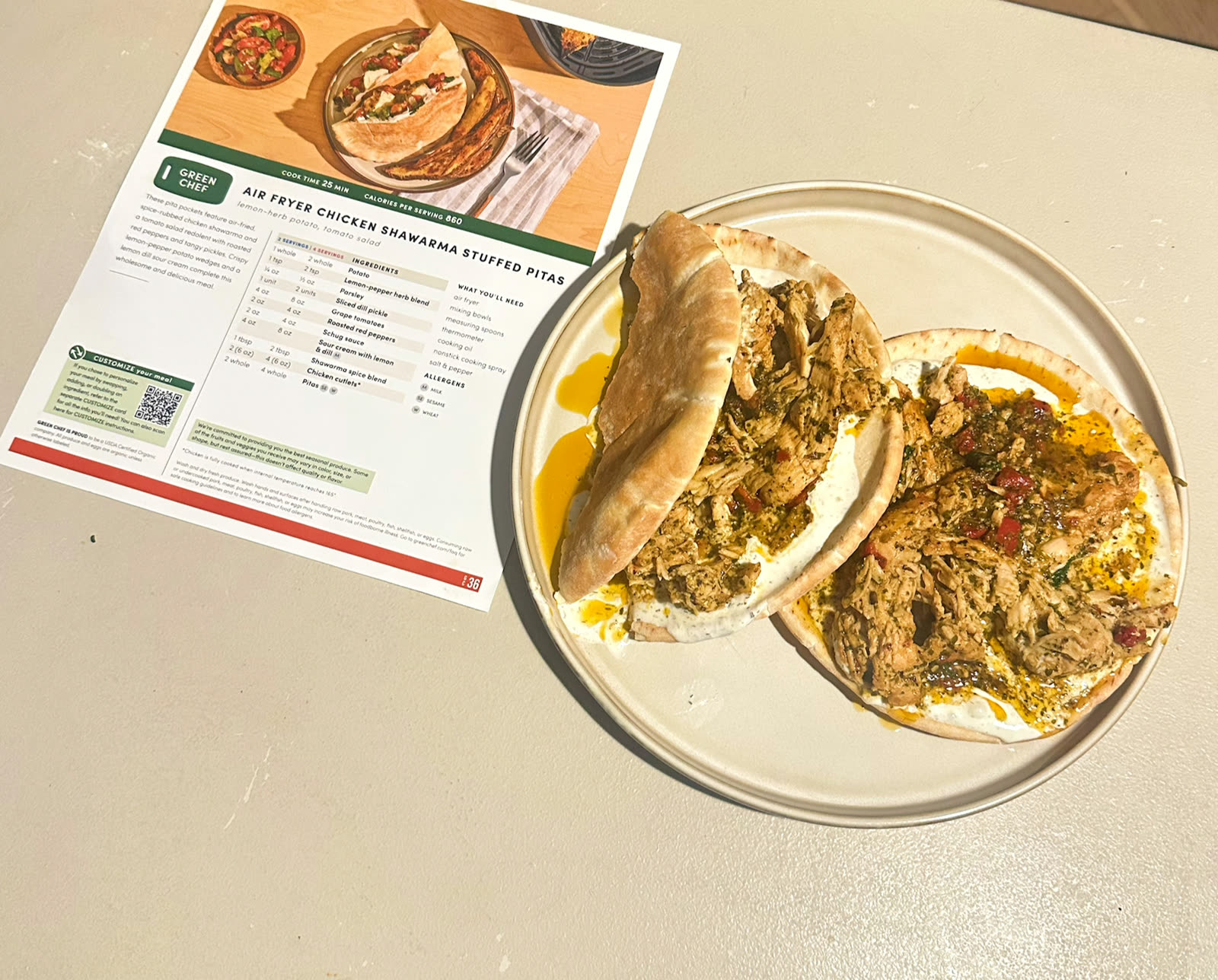 Air Fryer Chicken Shawarma Stuffed Pitas plated next to the Green Chef recipe card