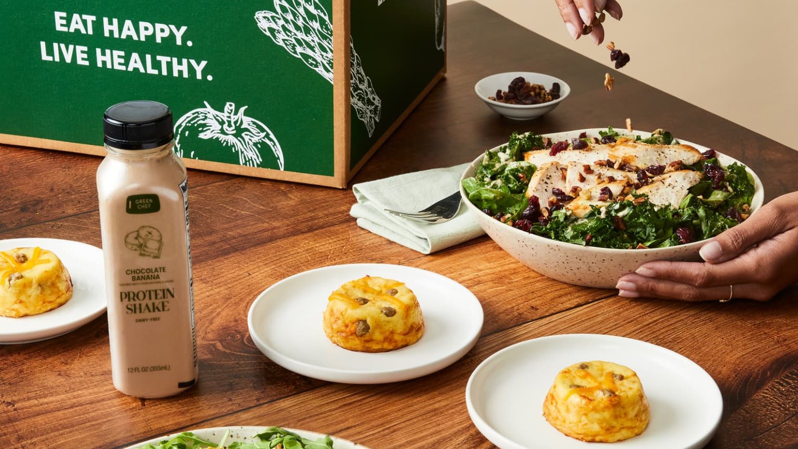 A Green Chef box with a kale and chicken salad, a protein shake and baked egg bites